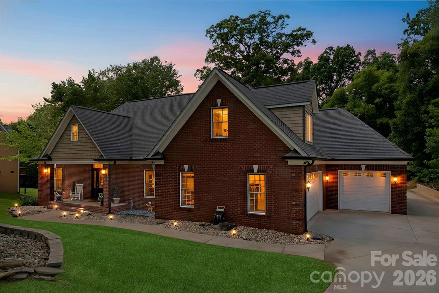 Stunning Six-Bedroom Custom Home with a Fully Finished Basement Suite on 1.41 Private Acres in Cramer Woods – Loaded with Upgrades and surrounded by top-notch schools!

This exceptional custom home offers the perfect blend of luxury, function, and space. Soaring ceilings, detailed moldings, and an open-concept layout create an inviting main living area, anchored by a dual-sided fireplace that seamlessly connects indoor and outdoor living—perfect for relaxing, birdwatching, or enjoying the peaceful sounds of the in-ground koi pond waterfall.

The stunning kitchen is a true showpiece, featuring granite countertops, double wall ovens, a pot filler, an oversized island with a breakfast bar, a built-in desk, and an expansive walk-in pantry with abundant cabinetry and storage.

The main level includes two secondary bedrooms and a full bath, along with a spacious primary suite showcasing a lighted tray ceiling and large windows. The fully renovated primary bathroom is a true retreat, highlighted by a rare double-sided freestanding soaking tub, a glass-enclosed shower, dual vanities, and a generous walk-in closet.

Upstairs offers additional bedrooms/bonus space and a full bath, along with custom built-ins, wide hallways, window seating, and endless storage throughout.

The fully equipped second living quarters are ideal for multi-generational living or guests, featuring a full kitchen with granite countertops and tile backsplash, a dining area, a living room with a fireplace, a bedroom, a full bath with a double vanity, an oversized closet, an additional half bath, and a covered patio.

Additional features include a safe room, tankless water heater, and a double garage with built-in cabinetry and a workbench.

All of this sits on a beautifully landscaped 1.41-acre private lot complete with a fire pit, mature trees, and vibrant flowers—your own personal retreat. And the back yard is perfectly blank canvas for your dream pool!

Tavel for work or for fun often? Just 12 miles or 20 minutes to Charlotte Airport!