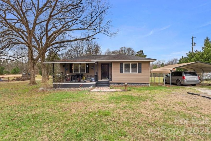 Adorable Cottage home located on 1.10 acres of land in desirable Clover, SC! This single family home features wood floors throughout the main area and has been recently painted. The kitchen features granite countertops , a glass cooktop, and newer soft close cherry cabinets as well as all white appliances. Relax on the front porch while you enjoy the beautiful Carolina sunset! There is plenty of room to add a pool , or even build another home and have this as a guest cottage or rental. Schedule your showing today!