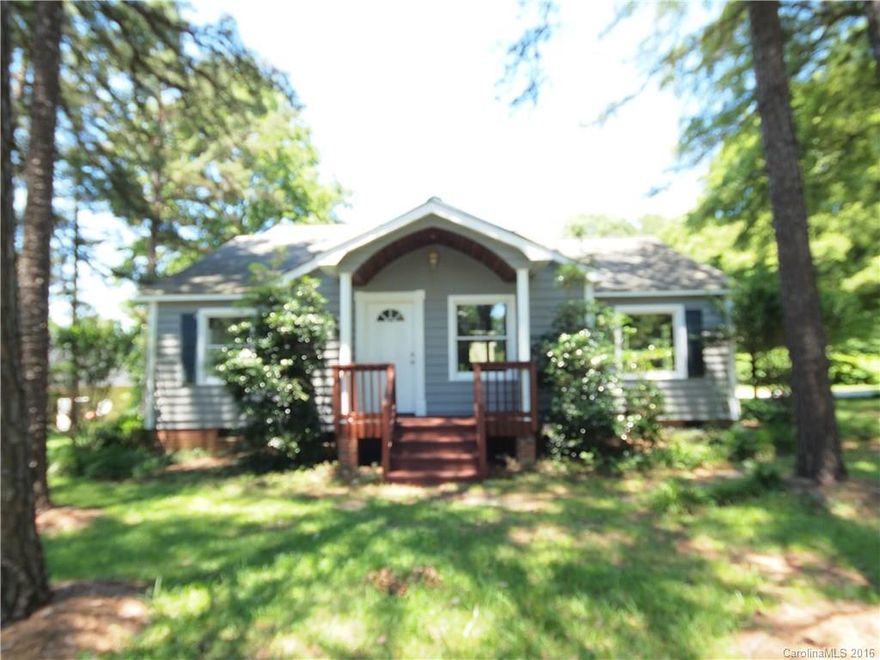 Convenient location! This 4 bedroom, 1.5 Story home has had lots of updates. Complete freshly painted interior and exterior, new flooring, quarry tiled bathroom, refinished deck and front porch. Kitchen has breakfast area, updated cabinets and countertops and all black appliances. Large great room/dining room area. Situated on a large level lot with storage building. Great location, an easy walk to shopping center. Great investment potential!