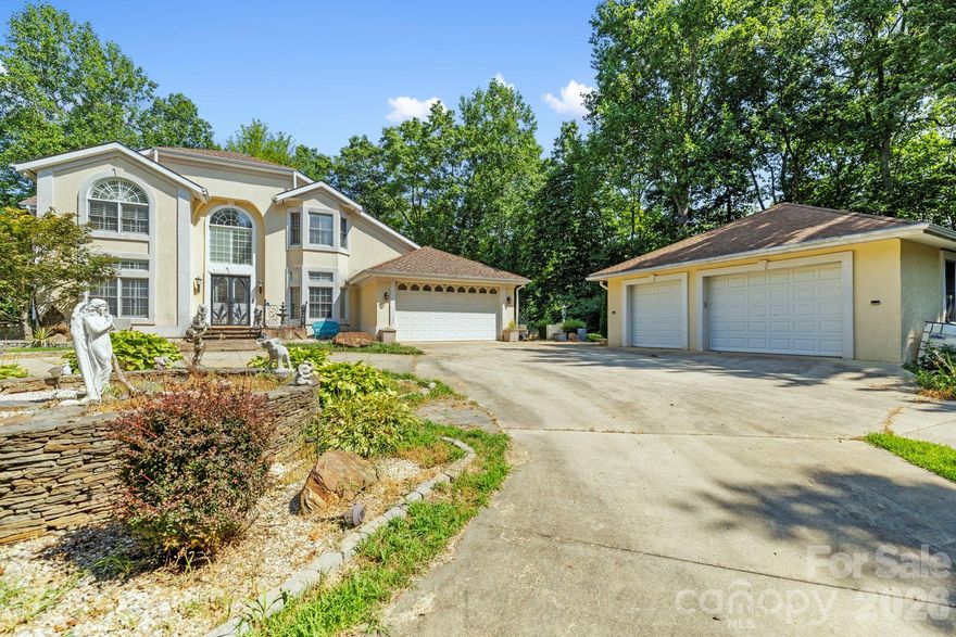 No HOA. Gated, fully fenced 3.29 acres in Arden — now offered under $1M.

652 Avery Creek Road offers a private, estate-style setting that’s nearly unheard of this close to everything. Fully fenced and set behind double gates, this property gives you the kind of freedom most buyers are searching for — room for dogs to roam, space to garden, and the ability to actually enjoy your land without restrictions. All just 5 minutes to Biltmore Park, 10 minutes to the airport, and 15 minutes to downtown Asheville.

The grounds themselves are something special. Mature landscaping, established garden areas, and a fountain with waterfall feature create a peaceful, tucked-away feel, surrounded by natural beauty and privacy in every direction.

Inside, this is a true three-level home designed for flexibility.

The main level is built for everyday living and gathering, with open spaces and access to outdoor areas. The upper level provides privacy and separation, ideal for bedrooms and quiet retreat space. The lower level adds a completely different layer of functionality, with additional finished and usable space for guests, recreation, work, storage, or future customization.

With 4 bedrooms, 4 bathrooms, and nearly 3,900 square feet above grade plus additional finished and flexible space below, there’s room here to live in a way most homes in this location simply can’t.

For those needing more than just living space, the property delivers. In addition to the attached garage, there is a large detached garage with workshop potential — ideal for car enthusiasts, hobbyists, or anyone needing serious storage and workspace.

A private appraisal completed April 8, 2025, valued the property at $1,125,000. It is now offered at $999,000 — creating a clear opportunity for the next owner.

A pre-listing inspection has been completed, and the seller has begun addressing key items, including HVAC servicing and general maintenance. The home is priced with remaining improvements in mind, allowing buyers to step in, personalize, and build equity.

No HOA. Fully fenced. Gated. Three levels. Detached workshop garage plus attached garage. 3.29 acres. Minutes to everything.

A rare combination of usable land, privacy, and opportunity — and now priced to get attention.
https://crosby-productions.aryeo.com/videos/0197e975-484a-73e3-b1ce-9f06028c715c