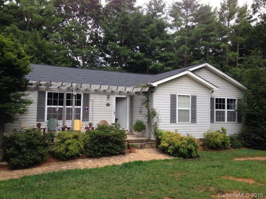 Cozy Country Retreat on 4.7 wooded acres close to Lake James. This one story full basement modular home features 3 bedrooms 2 baths on main, living room, large eat in kitchen with doors opening to backyard deck. New hardwood floors, new carpet in bedrooms, new paint. Finished basement adds third bath, private office, family room with gas fireplace. Outside are front and back patios, deck, fire pit, outbuilding for the perfect workshop, fruit and flower gardens surround this wonderful family home.