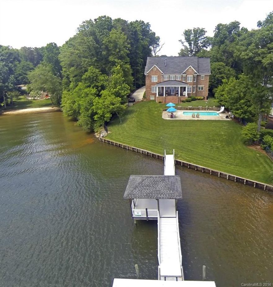 You won't believe your eyes! This LKN estate is a car lover's dream & perfect for multi-generational living. Master Suite & 2nd BR on main, Gourmet Kit, Study, 2-Story GR, Elevator, Media, 2nd Living Quarters w/ Kit upstairs & unfinished DRIVE IN BASEMENT. Garage space for at least 6 cars. Take in the sparkling views from the Covered Porch- or take a dip in your very own 28 x 14 pool with slide.
