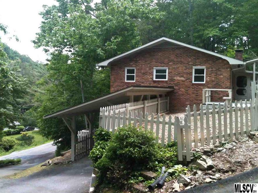 REDUCED! Totally remodeled home in the university town of Boone NC! Amazing interior! Completely remodeled 4 BR/3 BA near ASU, medical center, Samaritan's Purse, shopping, town center!  Over 2200 sq.ft. entirely new kitchen with cherry cabinets, black granite, new appliances, new wood floors. Remodeled baths with new vanities, tile floor, new fixtures, tile bath surround. All new flooring--hardwood, carpet, tile. New windows and doors. New drywall freshly painted. New heat pump. New roof. Lots of storage. BIG laundry ROOM with tile floor. Master BR has walk-in cedar lined closet. Two carports. Storage shed. Wooded lot - small yard - not much to mow! Living room is open to the kitchen - large fireplace, wood floors, big windows, spacious dining area.  Big deck overlooks Goshen Creek.  Live close to it all - don't waste your time and gas money driving a long ways back and forth to work and school.