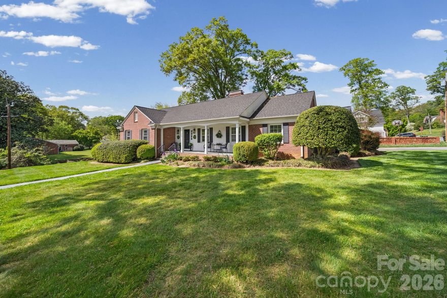 Experience the enduring elegance of this exceptional brick ranch, perfectly situated in one of Gastonia’s most coveted and picturesque neighborhoods. Nestled on a sprawling corner lot just a stone’s throw from the Historic District, this home is a testament to superior craftsmanship and "move-in ready" perfection. Gleaming hardwoods flow throughout a floor plan designed for both comfort and sophistication, while custom blinds frame views of the lush surroundings. The heart of the home is a magnificent, cozy den anchored by a stately fireplace the ideal sanctuary for crisp evenings.

The primary suite offers a spa-like retreat with a garden tub and separate shower, while the additional spacious bedrooms are joined by a thoughtful Jack-and-Jill bath featuring classic ceramic tile. Practical luxury abounds, from the cedar-lined attic closets to the functional laundry room with a dedicated sink and guest half-bath. Outside, the private backyard is a horticultural dream, featuring professionally terraced perennial gardens. With LeafFilter gutters and a versatile walkout cellar with an integrated mower workshop, this home offers total peace of mind in an unbeatable location.