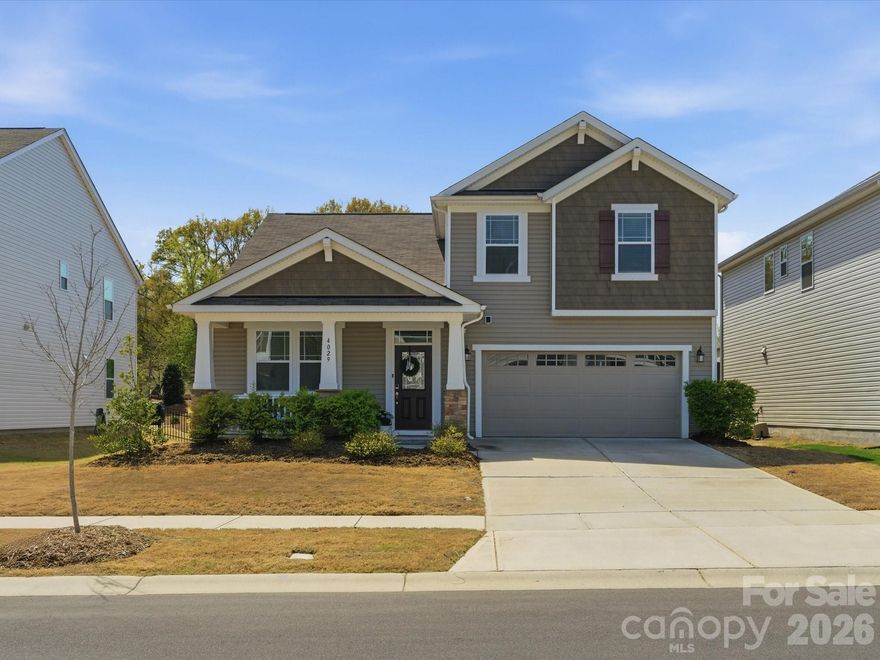 Better than new construction! Skip the wait and move right into this feature-packed home that comes with all the "after-market" upgrades you actually want: custom blinds, a fully fenced yard, upgraded designer lighting, and a Tesla charging port in the garage. The open-concept main floor features a dream kitchen island perfect for entertaining, Large Walk-in Pantry, while the primary suite offers a true retreat with a soaker tub and dual vanities. Walk-in closets in 3 of the 4 BR! Need a quiet space? The massive upper-level loft features reinforced insulation for a sound-protected cinema or music experience without bugging the neighbors. This home is located on a quiet cul-de-sac street and just steps away from the Long Creek Greenway! With easy access to I-485 too, this home truly has it all!