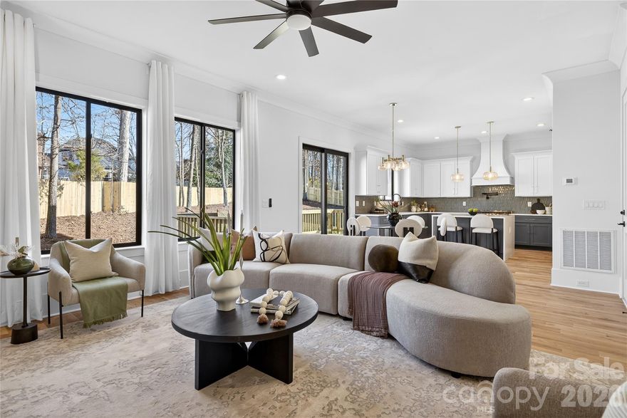 This beautifully crafted home is located in Charlotte's desirable Steele Creek area on Riverpointe Drive. The thoughtfully designed 4-bedroom, 3.5-bath floor plan features soaring 10-foot ceilings on the main level, an open layout ideal for entertaining, and a well-appointed kitchen with a large island, walk-in pantry, and sunny breakfast nook. The inviting family room with fireplace and a flexible main-level space offer both comfort and versatility for everyday living. Upstairs, the spacious owner's suite showcases a spa-inspired bath, while secondary bedrooms provide ample room for family or guests. Conveniently situated near Lake Wylie, RiverGate Shopping Center, and I-485, this home offers modern living in one of Charlotte's most sought-after areas.