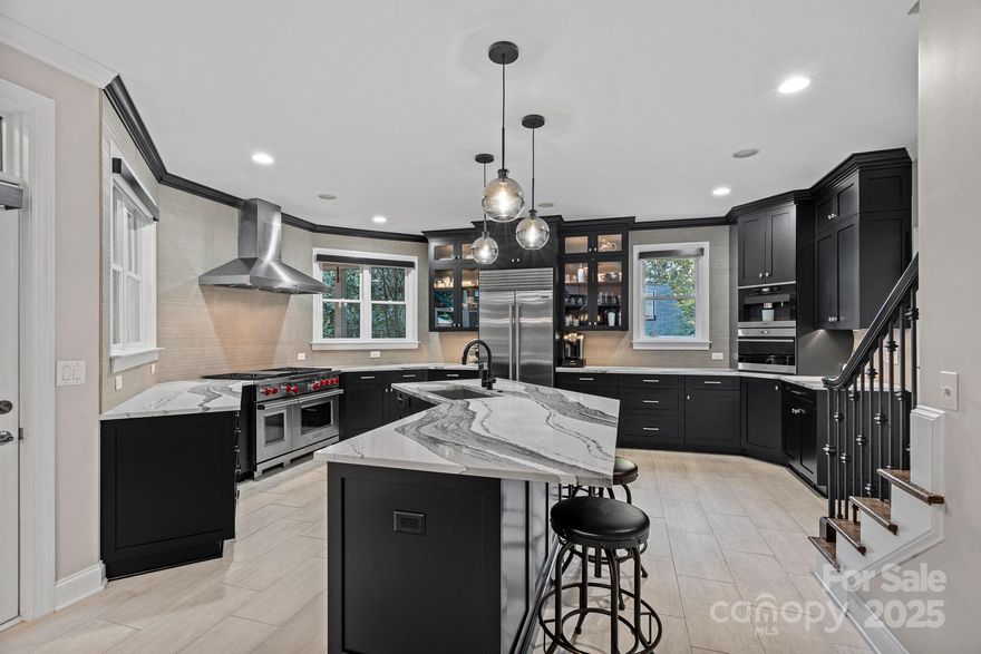 Luxury Smart Home in River Run with Resort-Style Entertaining Spaces! Located in the highly desirable River Run neighborhood, this beautifully updated 5 BR, 4.5 BA home offers just under 5,000 sq ft on a private, wooded .53-acre lot with lush landscaping and a large grassy yard perfect for a pool. Enjoy an open floorplan with walls of windows, 2-tier outdoor terrace with hot tub, waterfall, pond, and custom basalt fountains. Smart home features include Control4 system, programmable lighting and shades, smart irrigation, and video doorbell. The renovated primary suite features a Jacuzzi tub, heated tile floors, and backlit quartz accents. The updated gourmet kitchen offers SubZero & Wolf appliances, oversized island, and built-in Miele coffee machine. Kitchen & bathroom renovations completed by luxury home builder, Simonini Homes. The entertainment-ready lower level includes a complete gym with plyometric tile flooring, a 250+ bottle wine cellar, home theatre room, a bar with 2 built-in kegerators with 4 taps, beverage refrigerator, ice maker, sink, dishwasher, and backlit honey onyx accents. New roof and driveway (2023). Enjoy top lifestyle amenities at River Run Country Club including golf, tennis, pickleball, pool, and trails with easy access to downtown Davidson, Charlotte, and Lake Norman. (Club memberships available but not included.)