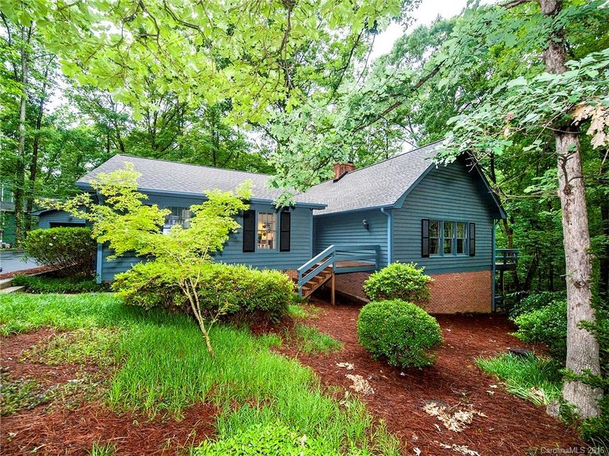 Renovated and charming with custom upgrades not found at this price. Great room has lg. wood burning fireplace and hardwoods. Inviting kitchen has double ovens, granite, travertine floors, bar with seating. Master suite on main. Master bath has steam shower, granite counters and travertine floors. Lower level has large family room and b/r with fireplace.  Garage is a guy's paradise, htd, cooled, wired for tv and audio. New roof  2016. Wooded yard. Whole house wired for audio. Lots of decking.