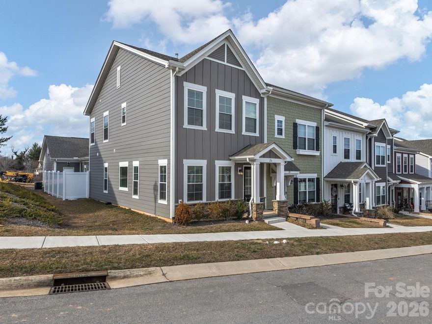 Light-filled end unit townhome in a prime Asheville 28804 location! This thoughtfully designed home features a luxurious primary suite on the main level with a spa-like bath, creating a private retreat. The open concept floor plan showcases designer finishes, seamless flow, and abundant natural light that's perfect for both everyday living and entertaining. Upstairs, two spacious bedrooms share a Jack-and-Jill bath, offering ideal flexibility for guests or home office space. Enjoy a private patio for relaxing outdoors, plus access to beautifully maintained common greenspace. Complete with a two-car garage, this exceptional home combines comfort, style, and convenience just minutes from all that North Asheville and Weaverville have to offer.