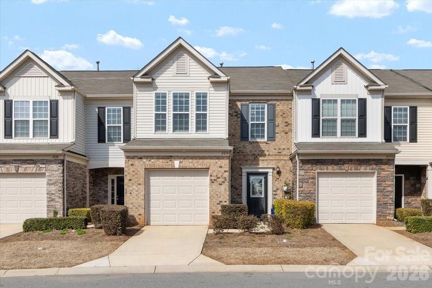 Beautiful townhouse in Park South Station that is one of the more private units in the community, featuring real hardwood floors throughout the entire home and a larger fenced-in backyard — something rarely found here. There is also private access to the greenway from the neighborhood! The home sits in a wonderful position within the neighborhood, with open green space both in front and behind, giving it a more peaceful and spacious feel than most townhomes. Inside, the layout is open and inviting, with the living room flowing seamlessly into the dining area and kitchen, making it perfect for entertaining or everyday living. A convenient hall bathroom on the main level is great for guests, and the home also includes a one-car garage with additional storage. Just off the main living space, the fenced-in backyard offers a great private outdoor area overlooking the community green space — ideal for relaxing, pets, or enjoying time outside. Upstairs you’ll find a large primary suite with a walk in closet and bathroom, two spacious guest bedrooms, a full guest bathroom, and a dedicated laundry room. The thoughtful layout and natural light throughout the home make it feel more like a single-family home than a typical townhouse. The current owners have completed numerous updates including new lighting, appliances, hardware, fresh paint, a stair runner, custom closet shelving, and many other thoughtful improvements you will appreciate when seeing the home in person. The location of Park South Station is truly unbeatable. The community offers fantastic amenities including a pool, playground, fitness center, sidewalks, dog runs, and beautiful common green spaces. It is also ideally located in the SouthPark area, just minutes from SouthPark Mall, the light rail for easy access throughout Charlotte, and the greenway for walking or biking along the scenic creek. This home truly offers the perfect combination of privacy, updates, community amenities, and an incredible location.