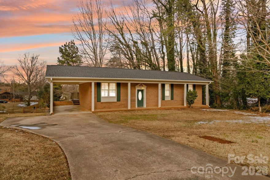 Welcome to this spacious split-foyer home offering approximately 2,005 heated square feet, including 520 square feet of heated living area in the basement, plus an additional 665 square feet of partially finished, non-heated basement space full of potential. With a flexible layout and solid features, this home is ready for your personal cosmetic touches to truly make it shine. The upper level features 3 bedrooms and 2 updated baths. Step up into an open-concept living, dining, and kitchen area ideal for everyday living and entertaining. The kitchen offers Formica countertops, range, and dishwasher, with great connection to the main living space. Bedrooms are generously sized, and both full baths have been refreshed with white cabinetry, tub/shower combinations, and a clean, spa-like feel. The heated basement living area is highlighted by a cozy brick wood-burning fireplace, creating the perfect second den or recreation space. The additional non-heated basement square footage provides endless possibilities — finish it for a bedroom, office, workshop, or hobby area and tailor it to your needs. A convenient half bath is located on the lower level. The home is connected to city sewer and served by a community well through Aqua America. Outside, enjoy a large fenced backyard on .42 acres — ideal for play, pets, and outdoor gatherings. Conveniently located near shopping, restaurants, and I-85, this home offers space, versatility, and an excellent location.