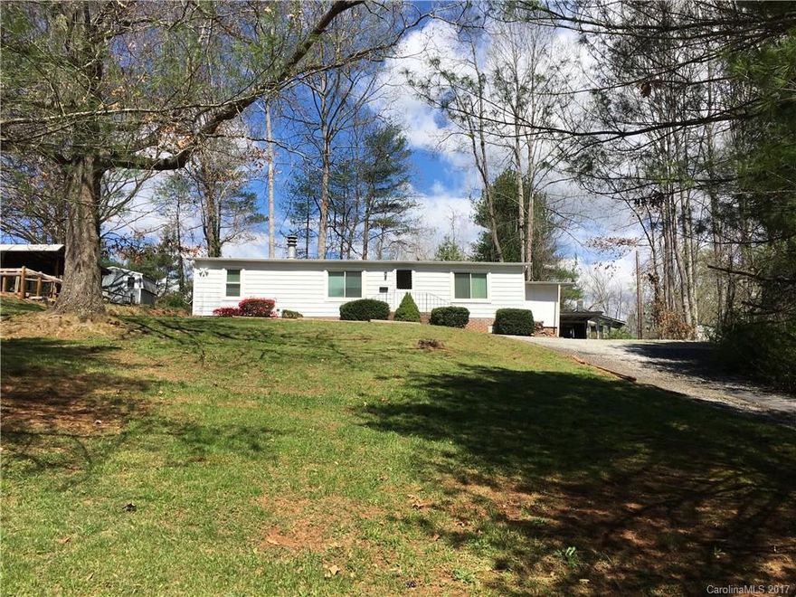 Priced to Sell Quickly. Come and see this well maintained 1984 Manufactured Double-Wide in fantastic shape. Cozy fireplace and open LR/DR area. Large closets in bedrooms. Set up your appointment today. Easy access to Hwy 25 to Asheville and Hendersonville.