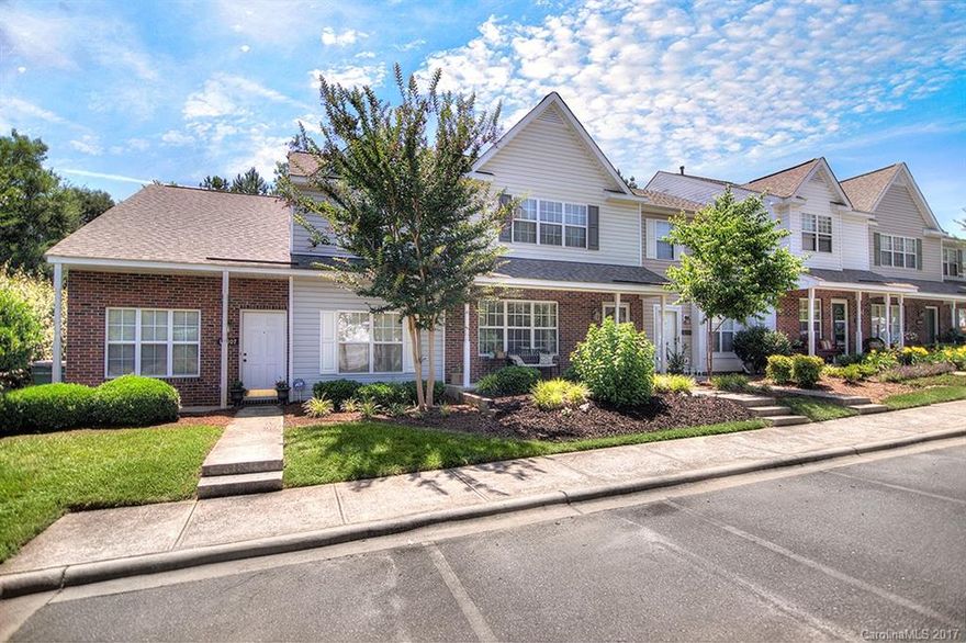 Move in ready townhome in convenient location!  Many updates throughout, neutral colors and neat as a pin!  Open GR w/corner gas log FPL adjacent to dining area.  Lrg kitchen w/crisp white cabinets & appliances plus eat-at island & plenty of cabinet & counter space.  1/2 bath w/granite.  French door leads to private patio w/privacy fencing & trees.  2 BR up each have vaulted ceilings & large closets.  Covered front porch.  Walk to community pool.