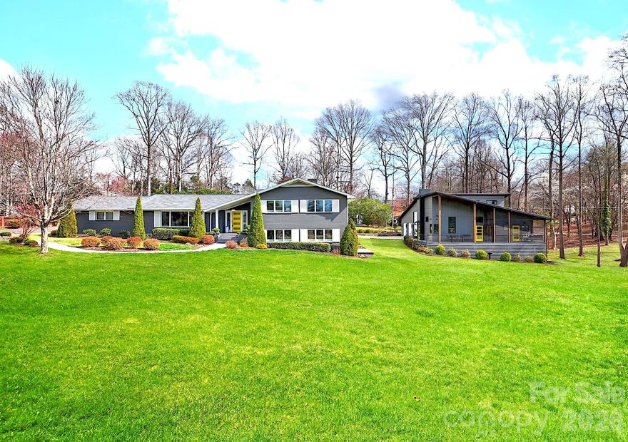 TWO individual Luxury residences presented together to create one remarkable estate. Each home showcases its own architectural character and modern design. 438 Country Club Acres features a Main Residence PLUS Luxury ADU (Accessory Dwelling Unit)— a private 2 Home Estate designed for multi-generational living, guests, RVs, car collecting, or income potential. NO HOA. Perfectly positioned on 1.3 peaceful acres directly across from the fairway at Cleveland Country Club, this rare offering features an Impressive MODERN 4-bed/3-bath Main Residence PLUS Luxury ADU (Accessory Dwelling Unit) 3-Bay Bardominium (Built 2021). A fully self-contained 1-bedroom, 1-bath retreat with its own living area, kitchen, exquisite bathroom, laundry, private entrance & parking. Whether your passion is hosting extended family, RVs, car collecting, boats, equestrian trailer, motorcycles, workshop, gym or considering rental income, this space offers endless possibilities. Located only 50 minutes from Charlotte, this contemporary masterpiece has it all -- The Main home offers both Upper & Lower level Primary Suites. Every detail has been thoughtfully curated -- the light-filled open floor plan showcases modern style with white oak floors, designer lighting and new sliding doors to outdoor spaces. The sleek gourmet kitchen is the perfect gathering spot with large island, honed quartz countertops, glass tile backsplash, high-end appliances, double ovens and walk-in pantry. The Upper Level Primary suite boasts multiple closets and spa-inspired ensuite bath showcasing custom tile from Portugal, heated floors, soaring maple ceiling and custom lighted cabinets. Lower level offers an entertainment area with gas fireplace, bar and access to deck to enjoy the golf course view. 4th Bedroom has new FLOR carpet and large closet. Oversized laundry room has cabinetry, sink, and lots of room for additional appliances and storage. Exceptional craftsmanship at every turn: ALL Delta faucets and fixtures, SwissTrax flooring in main 2-car garage, sealed encapsulated crawl space, Central vacuum, and custom exterior shutters. The path to the Barndominium is surrounded by beauty and functionality with an additional 30Amp electrical hook-up for guests to recharge vehicles at the parking pad and a fully irrigated yard to keep the mature landscaping flourishing. The custom designed 2,600 sqft ADU (Accessory Dwelling Unit)/Barndominium greets you with Clopay garage doors: 1 RV-ready (10' x 14' tall) and 2 additional car bays. Metal construction with metal insulated interior walls keep garage at moderate temperatures. The RV-bay is fully equipped with RV hook-up: water, sewer, 50-Amp outlet & sink. Garage bays have linear drainage. Overhead loft provides additional storage. The gym has SwissTrax flooring AND split-system AC unit for comfort. The luxury ADU (Accessory Dwelling Unit)/Barndominium has zero-entry ADA doors/shower and contemporary design: vaulted ceilings, LV tile flooring, Zero-entry luxury bathroom. The oversized kitchen with honed leather quartz countertops, french door Monogram GE oven, induction cooktop, 2 drawer refrigerators and drawer microwave. Enjoy the wrap-around porch that overlooks the golf course. The outdoor shower and ventilated crawl space are more features of the practical luxury lifestyle you will enjoy at this estate property. Outdoor patio features a pergola with adjustable overhead louvers and firepit area perfect for entertaining. Luxury meets functionality at 438 Country Club Acres -- a property built for living well! Also shown as Residential listing MLS 4325388.