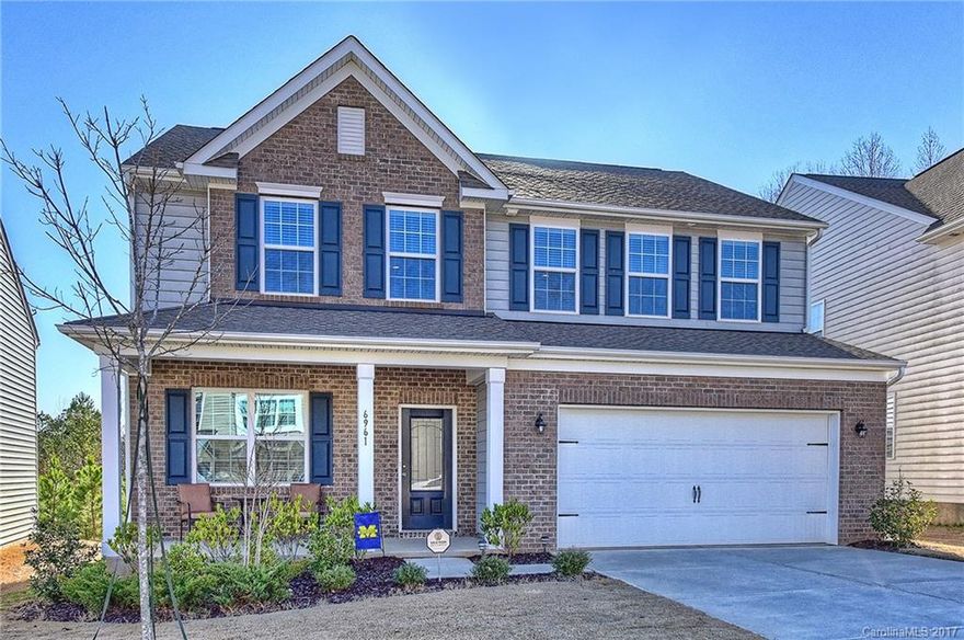 Beautiful pristine home in Carolina Reserve.  Hardwoods floors throughout the main level.  Spacious kitchen with tons of cabinet and counter space with large walk in pantry.  Large open great room with fireplace. Spa like master suite with separate garden tub and shower, dual vanities, huge walk in closet. Spacious secondary rooms with loft and laundry upstairs. Rocking chair front porch and wooded backyard.