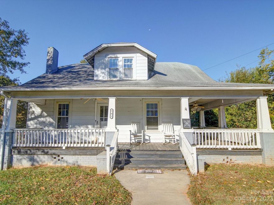 The Charles Jesse Bynum Reid House is located Belmont's Lincoln Park Neighborhood adjacent to Reid Park.  The Reid House will require rehabilitation in a manner that preserves important original features.  The house is being sold subject to protective covenants and a rehabilitation agreement to ensure that it will remain a well-preserved landmark representing an important chapter of our state's history.  The home features a welcoming wrap-around front porch with Craftsman details.  Interior features include fireplace mantels and a built-in china cabinet in dining room.   The home is sold "as-is".  Reimagine the bonus space as a jack and jill bathroom between the two upstairs bedrooms.  The building to rear of lot does not convey.  Seller is The Historic Preservation Foundation of NC, Inc.