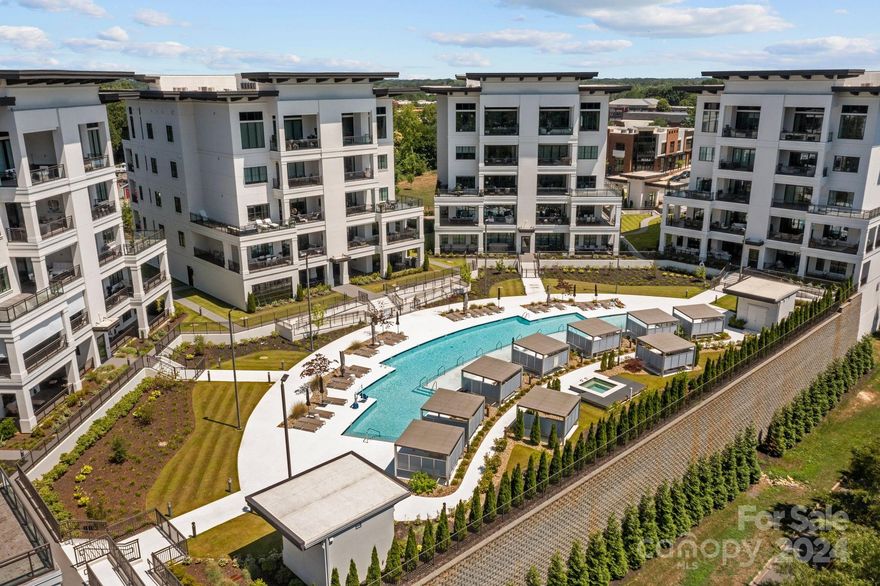 Welcome to Watermark. Luxurious, low-maintenance lifestyle with the finest custom finishes & amenities in the heart of Cornelius. Secure elevator access opens directly into your unit over 3000 sq. ft. Designer upgrades with custom drapery, power shades, & surround sound throughout. Chef’s kitchen features Sub Zero & Wolf appliances, spacious island, & lg walk-in pantry. Living room with fireplace flows onto the private wrap-around, north facing balcony through double sliders. The unit overlooks the lg pool, cabanas, clubhouse, fitness center, putting green, pickleball court & fire pit. Primary suite features a secondary balcony, free-standing tub, steam shower, & spacious walk-in closet. Two additional bedrooms w/en-suite baths, laundry rm w/built-in desk, & further pocket office complete this beautiful space. Two secured, designated parking spaces conveniently located adjacent to the elevator lobby & an owner's storage unit add to the convenience of Unit 142. Enjoy easy living.