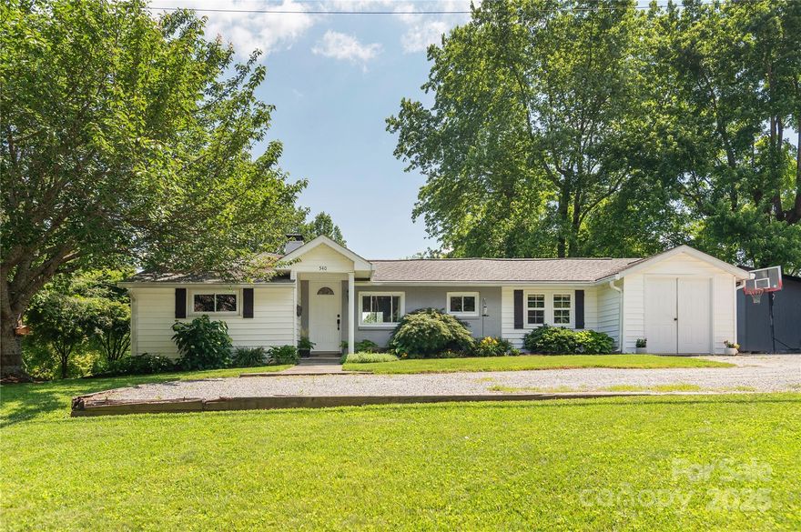 BACK ON THE MARKET AND READY FOR A NEW OWNER!!  Cute as a button and move in ready on this beautiful, unrestricted lot!  Open kitchen and sitting area, living room, den, plenty of extra space, and 2 1/2 baths - all on one level!  Outside you will enjoy multiple spaces, including ample parking, a level sitting area right out back, a fire pit area out by the yard, multiple outbuildings, including a large building up by the driveway!  Inside, you have extra space that is continuous to the finished home, but not heated directly.  This includes a large utility room, large laundry, and also a great storage room that currently is used as a small bunk room.  Although not included in the heated living area, the seller says that the heat from the main body of the home does reach some of this space.  All of this located only minutes from town, and ready for you to enjoy day one!  Shown by confirmed appointment only, no pulling in without this, please.