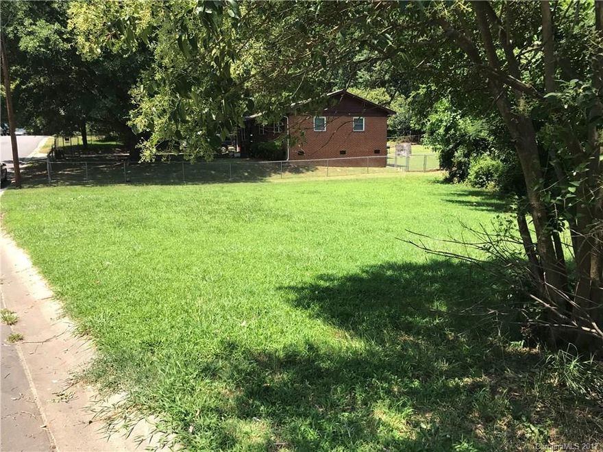 Vacant lot in an area of established homes. 15 minutes to uptown. Great for investors who may want to build a home for rental potential or building for affordable housing! There is a creek that runs parallel through the side of the lot.