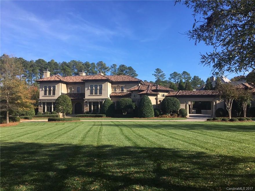 One of Longview's finest executive homes situated on 1.4 acre double lot with private back yard and superb curb appeal.  This Mediterranean inspired design features extensive millwork throughout, 9 ft. mahogany doors, marble floors, 4 stone fireplaces, circular drive, porte cochere with 6 1/2 car garage and courtyard.   Gourmet kitchen opens to patio & family room offers custom cabinetry, oversized 2-tiered island, Wolf/Thermador appliances. Large basement w/theater,bar/kitchen, gym & billards.