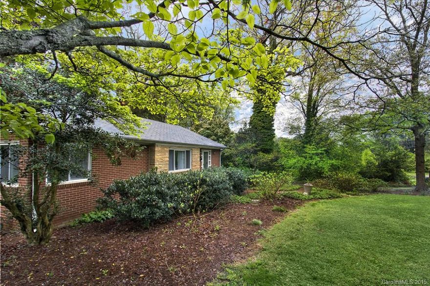 Ready to GET DIRTY?  Start digging your own garden in this oversized city lot. Filled with wonderful flowering species this is a gardener's delight. There is even a shed - perfect for a chicken coup + Large workshop /Garage space for all your hobbies. Solid brick ranch features a large living room with fireplace.Two bedrooms and a bath.  Wood paneled den could be third bedroom or great hang out with french doors out to large deck.  Large laundry / Sun room. Hardwood floors! Minutes from uptown.