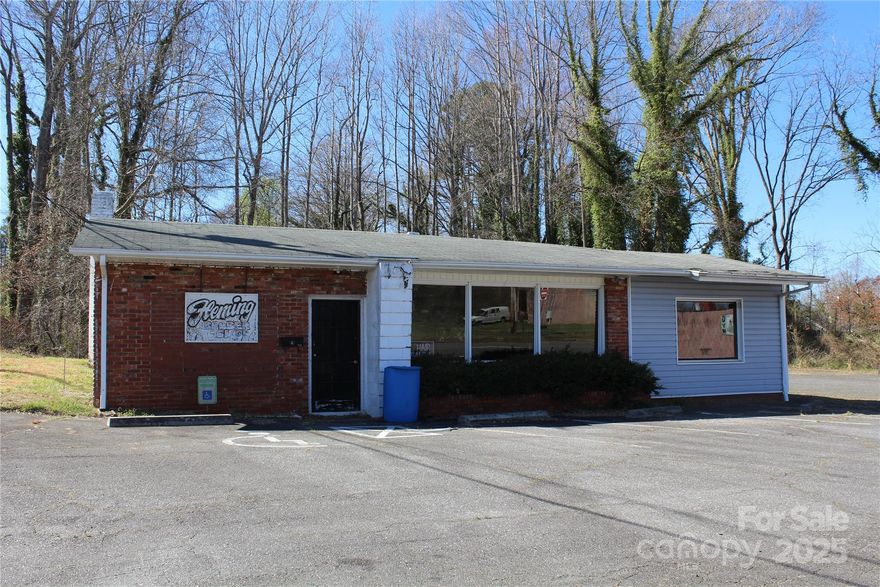 Come make this local barber shop your own! Conveniently located in downtown Morganton and featuring five stations currently, one styling chair and one barber chair this is the perfect opportunity to make your barber shop dreams come true! Building features an open floor plan with waiting area and office space plus his and her toilets. Building is equipped with natural gas and features a gas furnace and hot-water heater. Everything inside stayes.