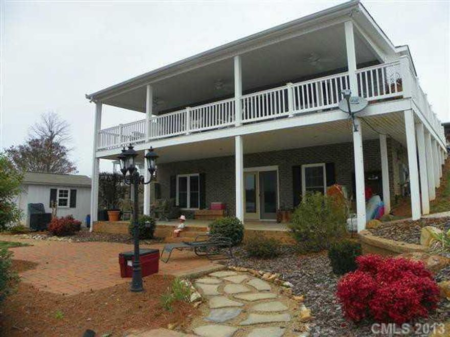Beautiful modular on the WATERFRONT with full basement, Beautiful landscaping, landscaped with no mowing in mind! Dual Zone heat (gas & Elec.),Sile Stone Counter Tops,Side by Side frig.,Custom cabinets,Ceramic Tile in Kitchen,HWD floors in LR,Eat at Bar in Kitchen,Gas Cook Stove,Double Sink, Wonderful Covered Porch out of LR. 2nd living area in basement. Covered patio.
