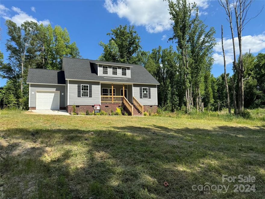 Come check out this stunning custom home with all of the upgrades and privacy you are looking for! New Construction! This 3-bedroom, 2 full bath home has luxury vinyl plank flooring throughout, custom kitchen cabinets with butcher block countertops and stainless-steel appliances! Open floor plan with coffered ceilings in the living room. High end finishes and ceiling fans in every room! Complete with a 1 car garage and ample parking spaces. The large, wooded lot is on a cul-de-sac just minutes from local schools, area work, and shopping. Outside find a beautifully landscaped yard with an abundance of privacy! The oversized back deck will be great for entertaining year-round! Sip beverages on the front covered porch while watching sunsets. Extremely quiet with only a few neighbors. Don't miss this opportunity to own this brand-new custom home in a prime location!