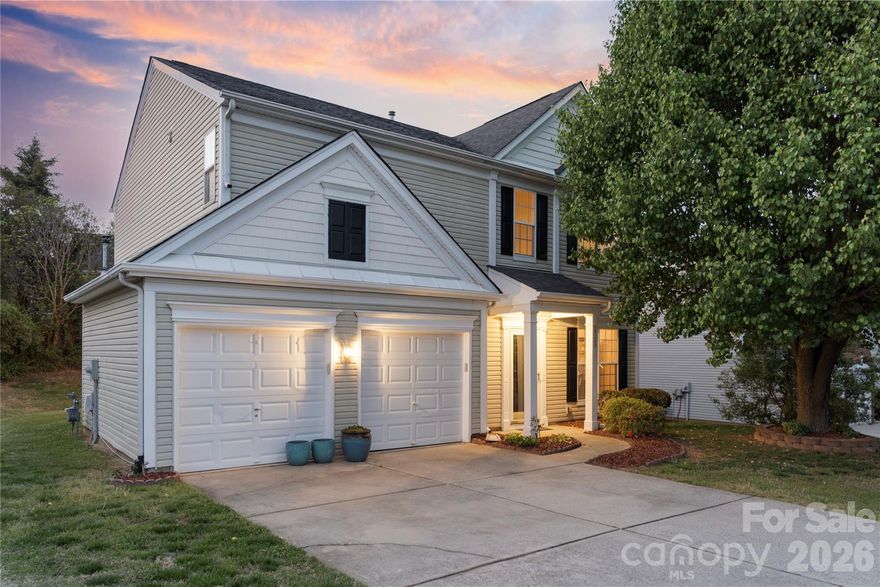 From the moment you step into the soaring two-story foyer, you'll feel it, this one is different. The great room draws you in with a gas log fireplace and beautiful natural light, while the kitchen keeps things functional and stylish with granite countertops and a gas range. Out back, your patio overlooks a tree-lined yard that feels like your own little retreat. Upstairs, four bedrooms and two full baths give every member of the household their own space, anchored by a primary suite with vaulted ceilings and a dual vanity that makes mornings feel a little more luxurious. Laundry is conveniently located on the same floor. Attached two-car garage, excellent storage, and impeccably maintained throughout. All of this in Newell Crossing — minutes from UNC Charlotte, TopGolf, IKEA, and a straight shot to Uptown. Move-in ready and priced to move!