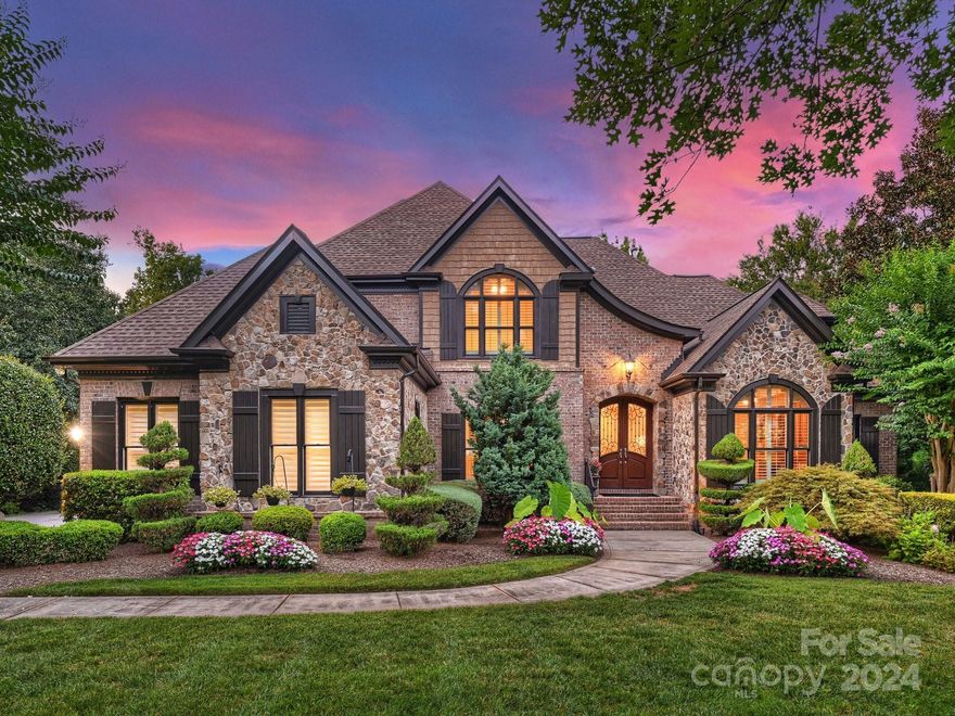 Stunning executive Ballantyne Country Club home with updates galore!In private cul-de-sac w/few homes,it boasts elegant architectural detail&perfect floorplan.Outdoor oasis has heated saltwater pool,spa & firepit w/travertine patio that creates great memories for family&friends!Study w/coffered ceiling,built-ins,French doors w/transom complimented by lovely dining rm.Dramatic 2 story great room adjoins kitchen &opens to gorgeous screen porch w/vaulted ceiling &stone fireplace overlooking pool&private yard.KIT has NEW quartz c'tops & subway tile backsplash,NEW induction range,NEW island,NEW Bosch m'wave,NEW lighting,dining w/domed ceiling.4"plantation shutters throughout.Primary suite on main w/double trey ceiling&rope lighting,NEW quartz countertops,fixtures & lighting,NEW custom closets.Jacuzzi tub&rain shower.Big BR's up w/walk-in closets,2BA&bonus rm.Basement has NEW wood floors,rec rm,billiard rm,kitchen/bar,fitness rm,BR suite,& flex room.3-car garage w/closet system& epoxy floor.