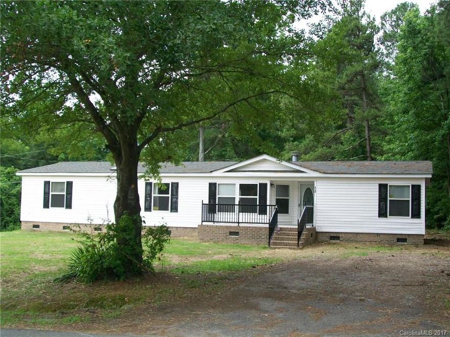 Wonderful double wide home.  Just renovated and set up for FHA Loan. with brick underpinning. Large living with ceiling fans and fire place, separate dining room, all bedroom with ceiling fans.  large utility room.