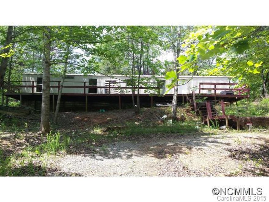 Abandoned mobile home in need of major reconstructive surgery or removal. sits on a .86 acre lot with septic and well in place. Please enter at own risk - no lockbox. Make an offer - owner motivated.