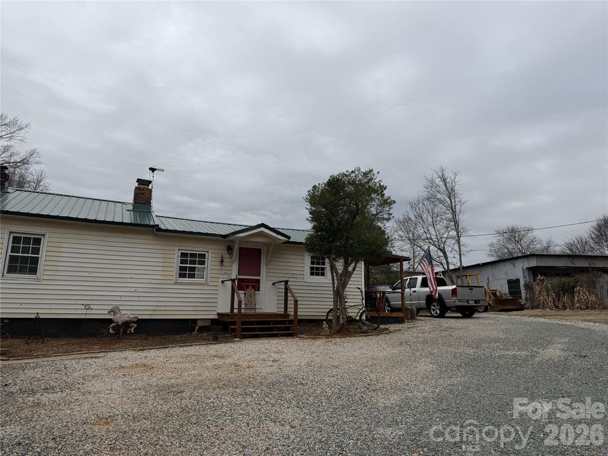 Huge opportunities and potential for this property with a large outdoor footprint.  This 2 bedroom, 1 bathroom home sits on 1 acre with no city tax, or HOA. There are two metal buildings on the property giving plenty of storage and workshop space with ample parking.  This home has a new metal roof, new HVAC, new ductwork and plumbing just minutes from downtown Waxhaw.