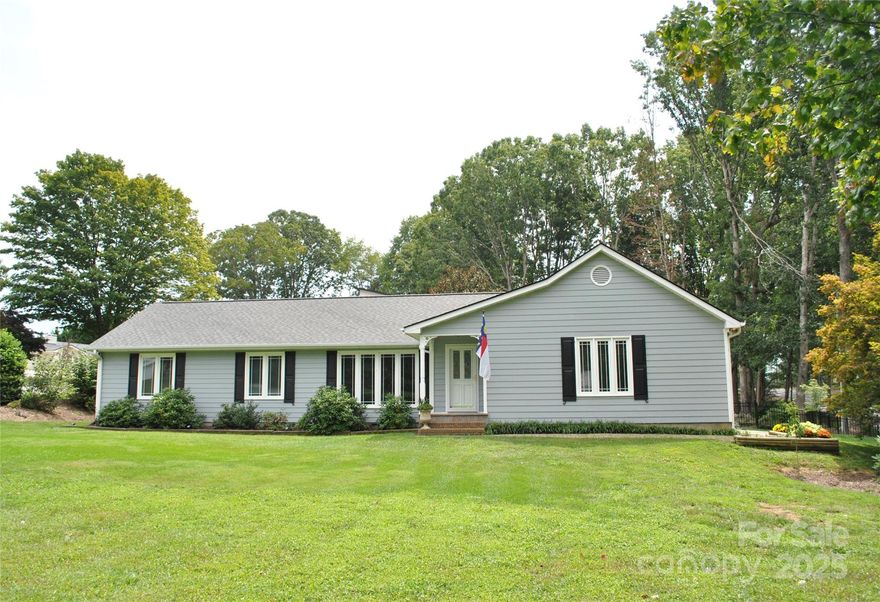 Immaculate, ranch-style home on a LEVEL lot, allowing you to be close to downtown Hendersonville, Fletcher and AdventHealth medical center. This three-bedroom, 2.5-bath home in MOVE-IN CONDITION features a living room, dining room/den, large eat-in kitchen with family room area and built-in features, and three spacious bedrooms. There's a nice-sized deck for entertaining or just enjoying the outdoors. This home has a beautiful setting with fenced back yard and a large storage building painted to match the house. Large (and heated!) two-car garage with pristine epoxy floor. Crawl space has been encapsulated. Siding is hardboard masonite composition. Windows have a lifetime transferrable warranty. Refrigerator in garage included. Enjoy a friendly neighborhood, no HOA. Make plans now to see this exceptional home. Motivated seller!