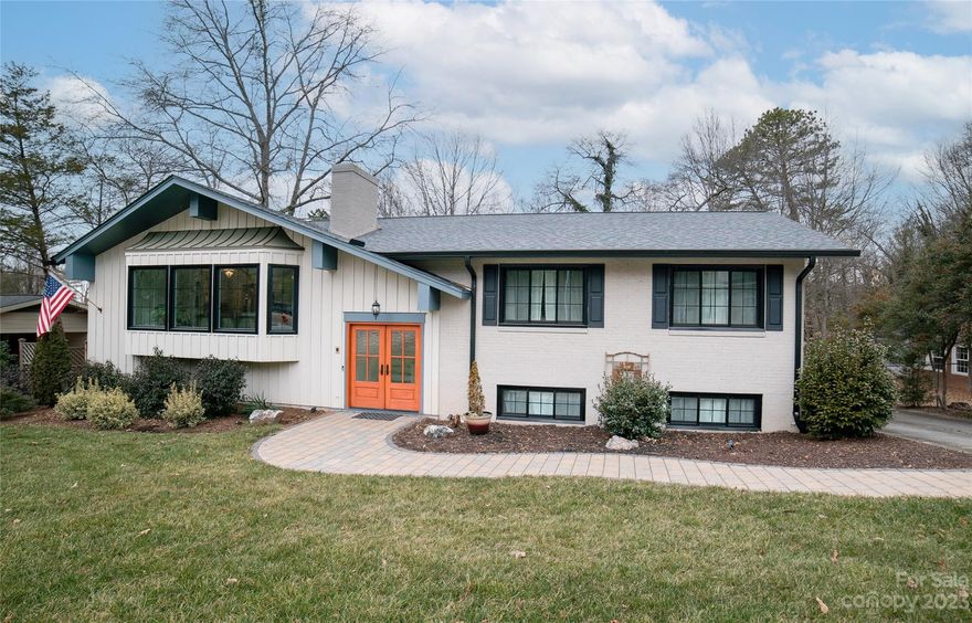 Updated contemporary design in this conveniently located downtown home.  A private wooded setting yet close to downtown restaurants, shops, movies, and more! This split-level home offers plenty of room to spread out. Main level features open foyer, breakfast and dining area w/ fireplace, kitchen w/ quartz countertops and walk-in pantry, large living room, three spacious bedrooms, two full baths, tile shower and bath, and a screened porch.  Lower level includes bonus room w/ fireplace, half bath, and large workshop/storage.  Outside patio opens to a fenced in area.  Nice back yard provides a fire pit and outbuilding.  Lots of other extras!  Walk to Catawba Meadows Park to enjoy access to the greenway, playgrounds, volleyball, disc golf, and much more!  $10,000 improvement allowance for outdoor deck space.