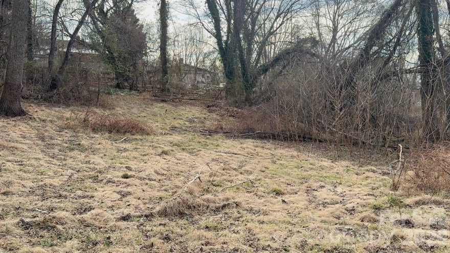 Prime West Asheville location, just a short walk to Haywood Road and its restaurants, shops, and local amenities. Approximately 0.55 acres with a long, a lot of potential. The existing structure is older and at the end of its useful life. No value was added for the home. Convenient access to Haywood Road, downtown Asheville and I-240.

Important Safety Note: Do not access the steps or enter the structure. The house is unsafe.

Zoning, redevelopment, and any subdivision or additional dwelling potential to be verified by buyer with the City of Asheville. 

Buyers and agents are advised that acreage is inconsistent across records: the county property card reflects approximately 0.65 acres, an older recorded plat calculates to approximately 0.55 acres, and the deed references approximately 0.49 acres. A current survey is strongly recommended to verify boundaries, acreage, and buildable area.