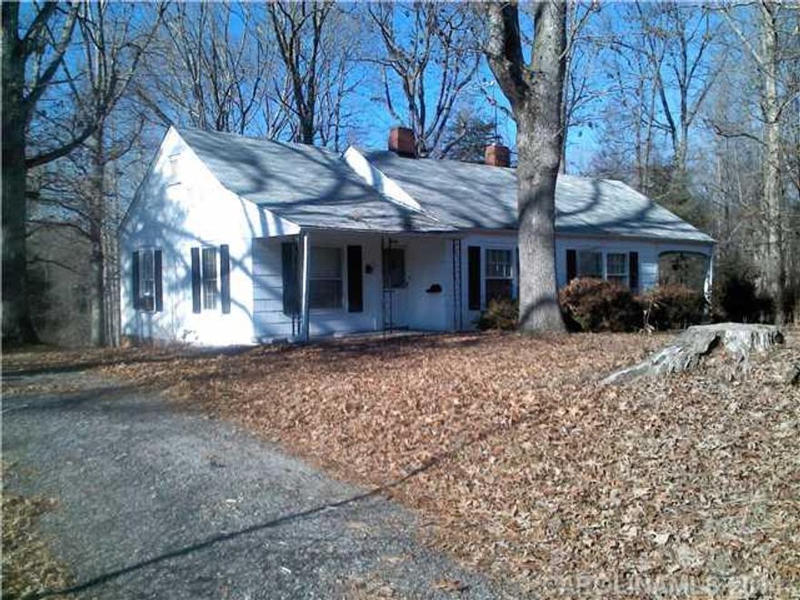 Beautiful 1.3 acre lot set in the quiet Sherrill’s Ford area surrounded by tall trees that provide wonderful shade for the home and acreage.  This home was built in the 1940s and retains its original charm, but does need work as time has taken its toll.  It is a perfect opportunity to make the home your own at a fraction of the cost of building new.  Motivated seller, bring all reasonable offers.  Additional up to 36 acres available with the home at additional cost.  Fixer upper