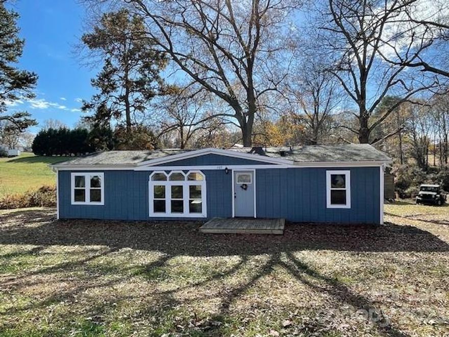 1988 DWMHome was renovated by previously seller in 2021 with a new roof, new deck and porches, new carpet, new flooring and nice neutral paint throughout.  Per seller, the home title has been surrendered and made part of real estate.  Home sits on a large city lot that totals approx. .79 acres.  Enjoy the extra large backyard and convenience to grocery store, shops, schools, etc. Storage Building does not convey