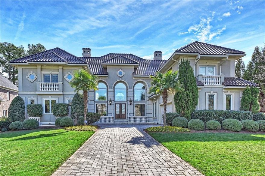 A stunning combination of estate, location & Lake Norman views. Lakeside features outdoor kitchen, multiple entertainment areas, along with oversized pool all overlooking the lake. Gorgeous two story great room has abundance of natural light, fireplace, views & bar. Hearth room off kitchen is perfect for dining or relaxing in comfort lakeside. Many extras - elevator, home theater, gym, second kitchen, two laundry rooms, two full bar areas, sauna, hot tub, wine cellar, heated/cooled garage & more