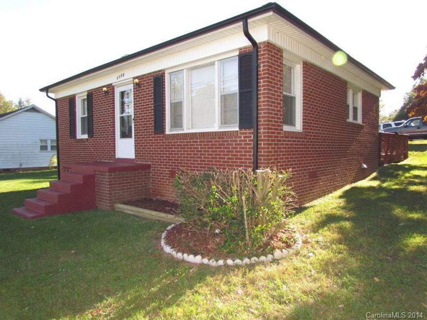 All-brick home has many updates & is ready to move-in. This home has 2 BR & 1 full bath featuring hardwood & ceramic tile flooring w/fresh paint throughout. The kitchen has updated back splash & comes w/electric range & refrigerator. The laundry hookups are located in the kitchen. Updates also include a new roof in 2011 &  heat pump in 2002. 10 X 12 deck for outdoor enjoyment & an outbuilding for your storage needs. Don’t miss this great house & value, a great potential for investors as well.
