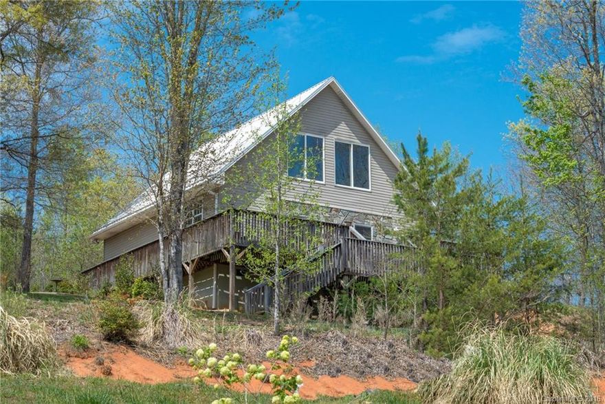 Light-filled home on level lot with mountain views! Lots of glass, 24' vaulted ceiling, and open floorplan! Newly re-finished wood floors. 2 generously-sized bedrooms on the main level. The loft on the upper level can be used for another bedroom, home office, art/quilting studio, or bonus/media room. And it has a great view! Kitchen is wired for dishwasher. Constructed with 30-year metal roof & 2x6 exterior walls. Driveway is flat with lots of parking. Very well-maintained home inside and out!