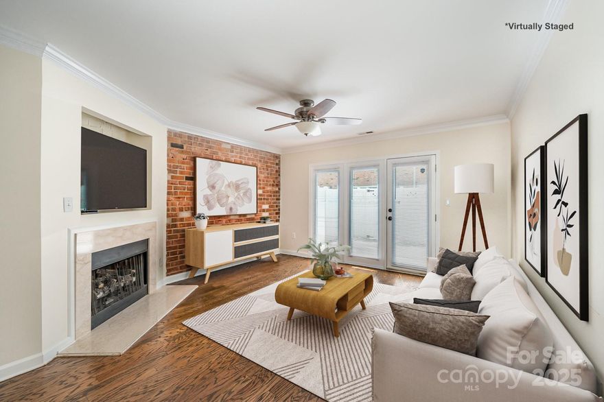 Welcome to your future home! This beautifully updated 2-bedroom, 1.5-bath condo offers modern comfort and classic charm in an unbeatable location. Step inside to discover refinished hardwood floors throughout the main level, leading you to a stunning exposed brick accent wall and gas fireplace in the living room. The updated kitchen features granite countertops, a sleek subway tile backsplash, and floating shelves for a modern, charming feel. This home has been thoughtfully upgraded with a tankless water heater (installed 2022), new washer and dryer (2023), new windows (in kitchen and bedrooms 2023), new toilets (2023), new blinds (2024), and new concrete poured for the back patio (2024). Just minutes from the vibrant energy of Plaza Midwood and Uptown Charlotte, this home blends convenience with character. Don’t miss your chance to own this move-in ready gem in a highly sought-after location!