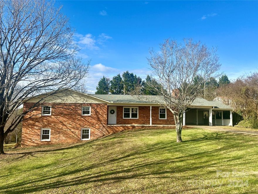 This 3 bedroom, 2.5 bath brick ranch is located in a very nice neighborhood in Hudson. The spacious great room provides a wonderful space for entertaining with its open concept. The fireplace is the centerpiece of the seating area and the dining area has a double sliding door leading to the screened back porch. The kitchen features a large island for extra seating and an abundance of countertop work space. Upgrades include quartz countertops, subway tile backsplash, new cabinetry, and new stainless steel appliances. There's also a formal living room, a very large primary bedroom, 2 additional bedrooms, and 2 full bathrooms on the main level. The basement has a finished half bath and laundry room that aren't counted in the heated square footage. There's a 2nd fireplace in the basement & plenty of room to add additional living area if desired. All new: vinyl plank flooring, carpeting, heat pump, garage door, vinyl windows, bathroom vanities, commodes, & light fixtures. Move-in condition!