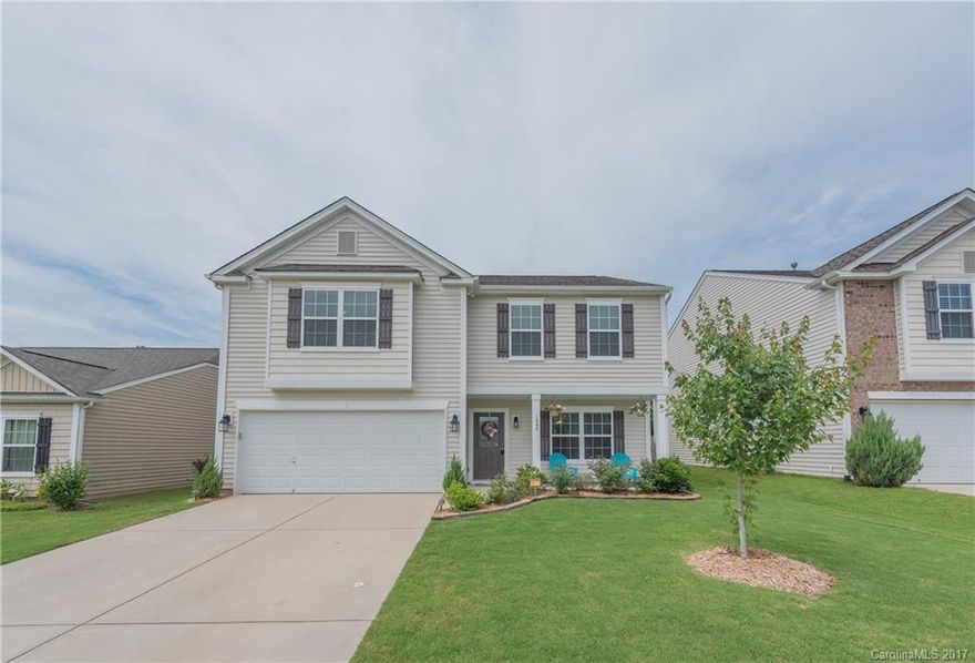 Inviting full front porch, level lot backing to woods and Sugar Creek. Bamboo wood flooring leads from foyer through dining room. Kitchen features new dishwasher! Great room features hand-scraped laminate flooring. Spacious bedrooms upstairs including a guest room with en suite bath access. Master suite with vaulted ceiling with ceiling fan and private master bath. 4th bedroom would be an awesome media room!
