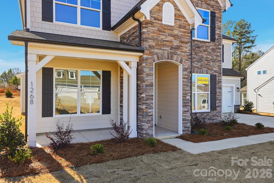 New community close to Lake Norman! This Colfax plan offers 4 bedrooms, 3.5 baths, a rear covered porch, and more than 3,300 square feet of living space. The main floor has an office with French doors and wainscoting, a formal dining room with tray ceiling, along with an open family room/kitchen/breakfast area. The family room features a Cosmo direct-vent gas fireplace inset in a shiplap feature wall. The kitchen has white cabinets with a contrasting dark grey island, quartz counters, tile backsplash, stainless range hood, and stainless appliances, including a gas cooktop. A butler pantry with upper & lower cabinets connects the kitchen & dining room. The upper floor has a loft with EVP flooring and three secondary bedrooms, including one with an en-suite bath. The upstairs primary suite has a tray ceiling, two walk-in closets, and a luxury shower. All bathrooms feature quartz counters. This home also has a 2-car garage with a large storage area, a covered rear porch, and a mud room with a built-in, beadboard drop zone. Community amenities to include an outdoor pool, cabana, pickleball courts & playground. Schedule a visit today!