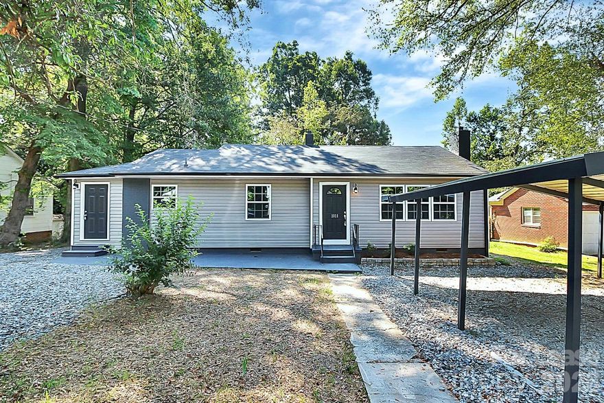 Welcome home to this beautifully remodeled ranch-style home located on a quiet dead-end street just steps from the vibrant FUSE District in Gastonia.

This 3-bedroom home has been thoughtfully updated and feels practically brand new. Enjoy a bright, open-concept floor plan featuring a fully remodeled kitchen with brand-new countertops, stainless-steel appliances, and updated cabinetry. Fresh, modern paint throughout the entire home complements the stylish accent-colored doors for a contemporary touch.

The spacious primary bedroom boasts a HUGE walk-in closet and private deck access—perfect for relaxing mornings or evenings outdoors. Additional highlights include:

Dedicated laundry area with washer/dryer hookups

Covered parking

Private deck off the primary bedroom

Massive shared backyard

Quiet, low-traffic dead-end street

Landscaping and water are included in the rent, making this home an exceptional value.

Move-in ready and waiting for you today!