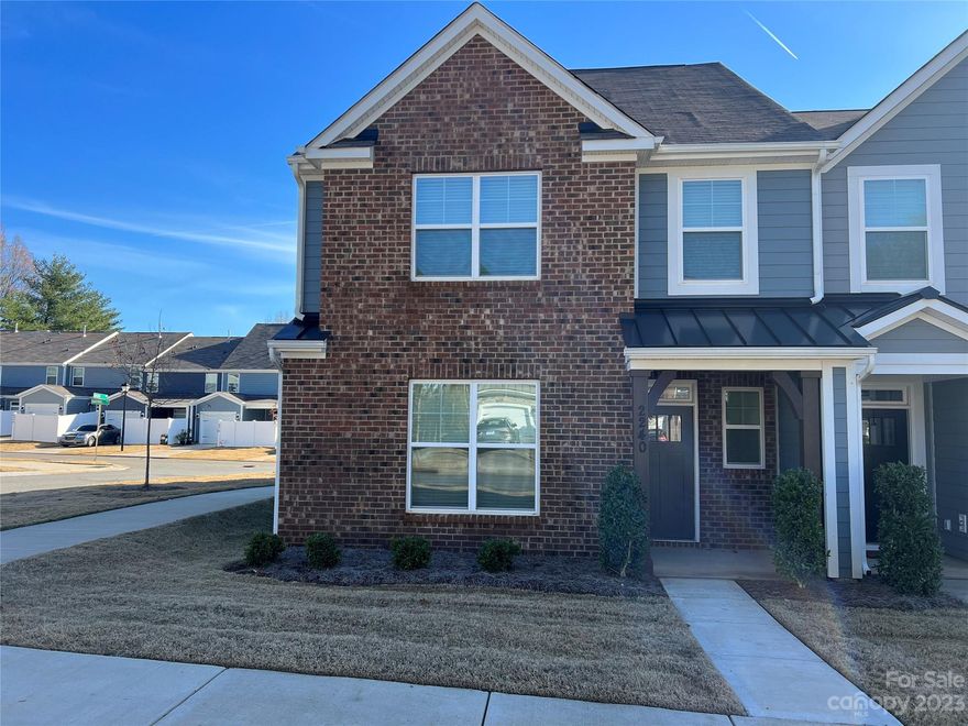 DESIREABLE END UNIT! this townhome has three levels and more than 2,200 square feet! The main floor features a den/flex space, pocket office, and drop zone along with the open family room/kitchen area. All bedrooms are on the second floor, and the third floor has a huge bonus room with more than 350 square feet. The kitchen has stone gray cabinets, quartz counters,  tile backsplash & stainless appliances, including a gas range. The owner's bedroom is accented with a tray ceiling, and the owner's bath has a tiled, walk-in shower with a bench seat. Other upgrades include a rear covered patio, a double-bowl vanity in the hall bath, metal balusters, and Enhanced Vinyl Plank flooring in the main living areas. This wonderful north Charlotte community is located within walking distance to shopping.