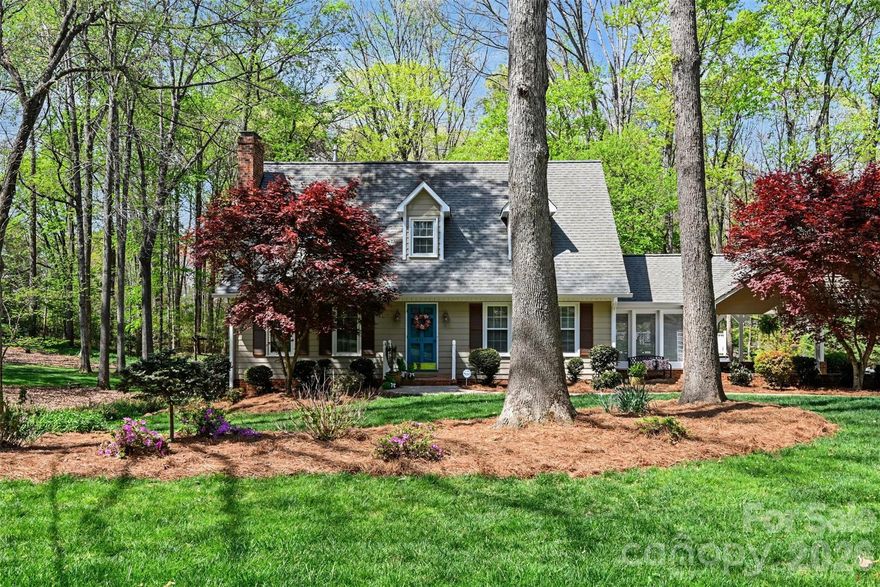 This picturesque home offers exceptional space and versatility, perfect for both everyday living and entertaining on a grand scale. With three fully finished levels, there is room for everyone to spread out and enjoy. Thoughtfully renovated in 2010, the home has been meticulously maintained and updated, making it truly move-in ready. Recent improvements provide peace of mind and modern comfort, including new windows installed in 2022, a water heater replaced in 2022, sewer work completed in 2023, and new gutters and freshly painted exterior trim in 2025. A new second-floor compressor was installed in April 2026, and the basement features new carpet from 2022. The roof was replaced in 2008, and a new pump was installed during the 2010 renovation.
Inside, the home showcases many custom features, including beautiful hardwood floors throughout much of the main living areas. The primary bedroom and main-level den both feature custom-built cabinetry, adding character and functional storage. The kitchen is designed to impress, highlighted by a large, attractive island that serves as a central gathering space for cooking, dining, and entertaining. Multiple living areas provide flexibility for a variety of lifestyles. Enjoy two separate family/den spaces, ideal for relaxation, media rooms, or hosting guests, along with a spacious basement playroom or flex space that can easily adapt to your needs—whether a home gym, office, or recreation area. Cozy up by either of the two fireplaces, both equipped with gas logs, creating warm and inviting atmospheres throughout the home. Outdoor living is just as appealing, with a generous deck that can be enjoyed across multiple seasons, offering the perfect setting for gatherings or quiet evenings. Situated on a beautifully sized lot, the property also includes an additional 0.5-acre corner parcel, providing even more space for outdoor activities, gardening, or future possibilities. With its combination of thoughtful updates, custom details, and abundant living space, this home truly has something for everyone. Come experience all it has to offer—you do not want to miss it!