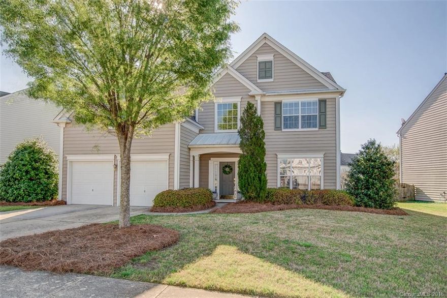 Stunning magazine quality home with 4BR, 2 1/2 BA, formal dining room, master suite on main , 4th Bedroom up can also be a bonus room. Transitional layout with abundance of natural light. Many upgrades including hardwoods, moldings, neutral decor. Bright kitchen with spacious cabinets, pantry, recessed lights and white appliances. Master retreat has garden tub and separate shower. Enjoy the outdoors from your covered patio and large fenced backyard. Community offers pool, tennis, and playground.