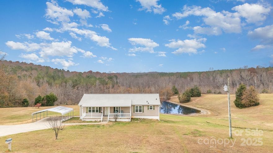 Beautifully Updated Modular Home on 2.82 Acres
Well-maintained modular home situated on 2.82 acres with stunning views and numerous upgrades throughout. Interior features include a gas fireplace, engineered hardwood flooring, Corian countertops in the kitchen and bathrooms, updated appliances, new windows, plantation shutters, upgraded light fixtures, faucets, and bathroom flooring.

Additional improvements include a tankless water heater, fairly new A/C unit, gutters, and front porch railings. The property offers an above-ground pool with deck, a two-car carport, and a full unfinished basement providing ample storage or future expansion potential. The spacious primary suite includes an ensuite bathroom with a garden tub and separate shower.

This home combines modern upgrades with peaceful surroundings—move-in ready and a must see!